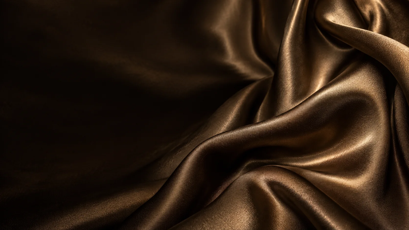 Bronze silk folds catching atelier light